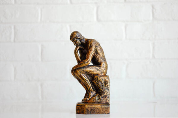 A small statue of The Thinker by Rodin