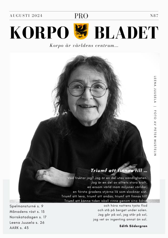 A woman with glasses and curly hair smiles while resting her face on her hand. She is featured on the cover of the August 2024 issue of Korpobladet.